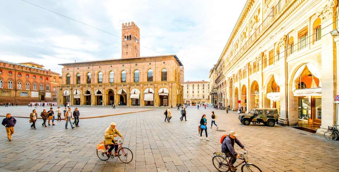 Piazza Maggiore in Bologna with people cycling